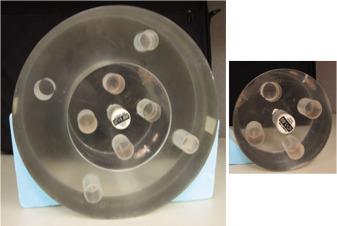 Fig. 3.3, Phantoms used for computed tomography number calibration for proton therapy. The large phantom at the left represents the “body,” with a diameter of 32 cm, and the smaller one at the right is the “head” phantom, with a diameter of 16 cm. The “head” phantom is a part of the “body” phantom and can be inserted into the “body” phantom.