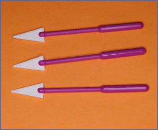 Fig. 15.4, Microsurgical spears are cellulose sponges used to dry the surgical field under the microscope.