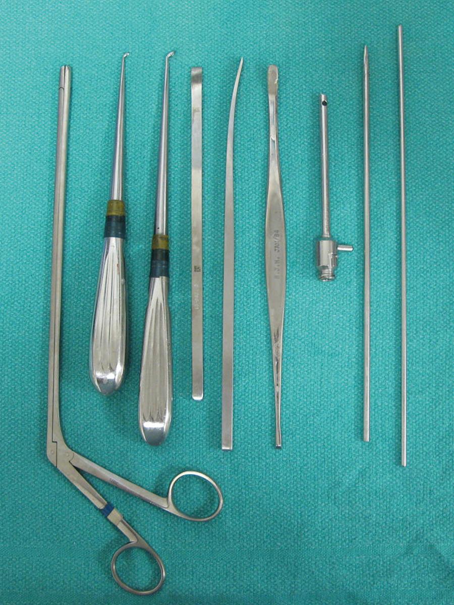 Fig. 26.8, Standard arthroscopy instruments that may be useful when conducting elbow arthroscopy. From left to right: a large pituitary grasper, angled curettes (2), straight and curved osteotomes, Howarth retractor, standard metal cannula, dull pointed switching stick, and a standard switching stick.