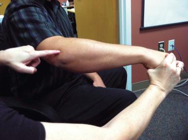 Fig. 61.1, Resisted wrist extension test for lateral epicondylitis.