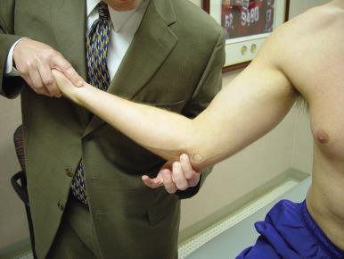 Fig. 64.2, Identification and palpation of the ulnar collateral ligament.