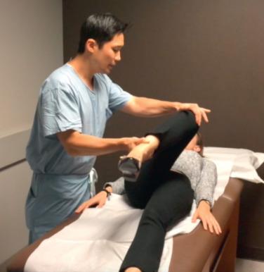Fig. 80.4, The FADIR (flexion, adduction, internal rotation) maneuver is shown, with the examiner moving the symptomatic hip to 90 degrees of flexion, adduction, and internal rotation. A positive test results in this position reproducing the patient's typical pain in the hip region.