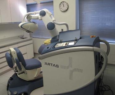 FIGURE 30.19, Robotic device used for follicular unit extraction.