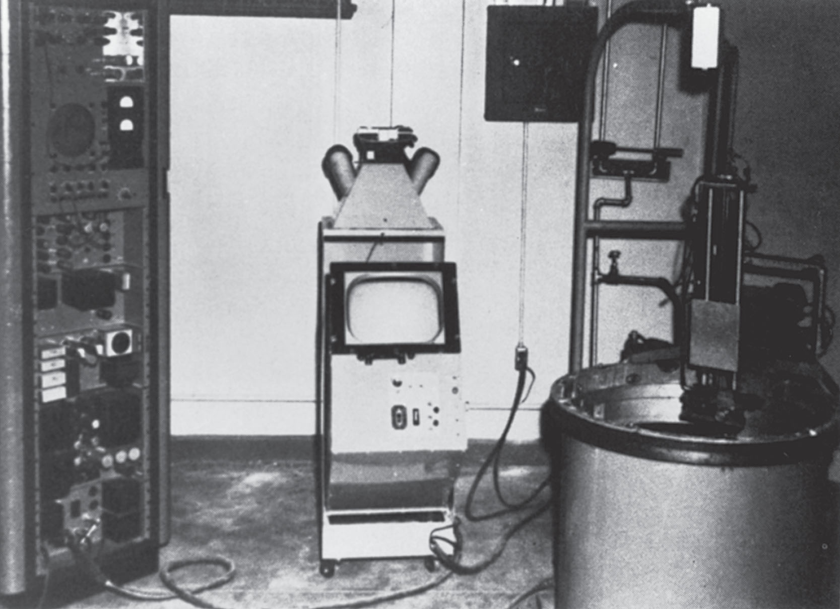 Fig. 1.2, Douglass Howry, along with William Roderic Bliss and Gerald J. Posakony, both engineers, produced the “immersion tank ultrasound system,” the first two-dimensional B-mode (or plan position indicator mode) linear compound scanner.