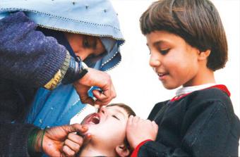 Fig. 3.3, Administration of bivalent oral polio vaccine in Jalalabad, Afghanistan.