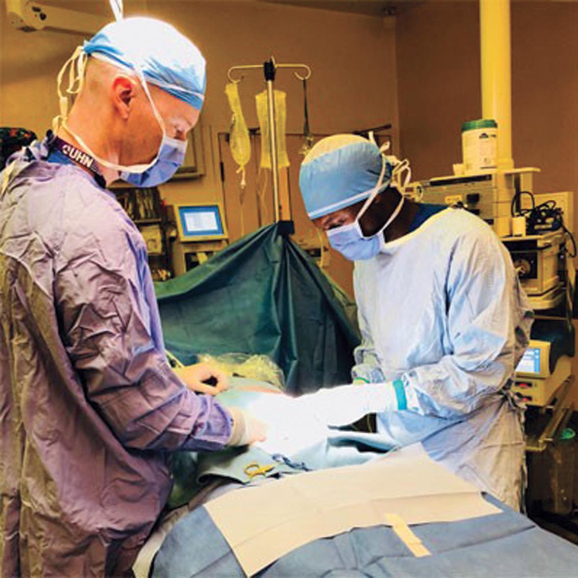 Fig. 6.3, PA Kwaku assisting in surgery in Ontario.