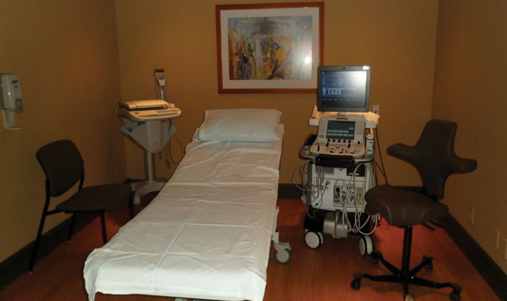 Fig. 32.1, Most echocardiographic examinations are performed with the sonographer’s left hand.