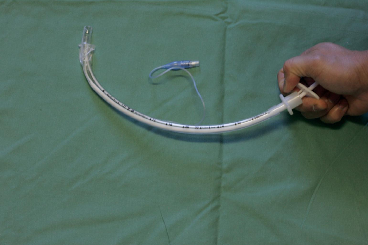 Fig. 22.2, The Schroeder Directional Stylet (currently sold as the Parker Flex-It Articulating Stylet, Parker Medical, Highlands Ranch, CO) can be used to elevate the tip of the endotracheal tube by wrapping all four fingers around the proximal tracheal tube and using the thumb to depress the proximal end of the stylet.