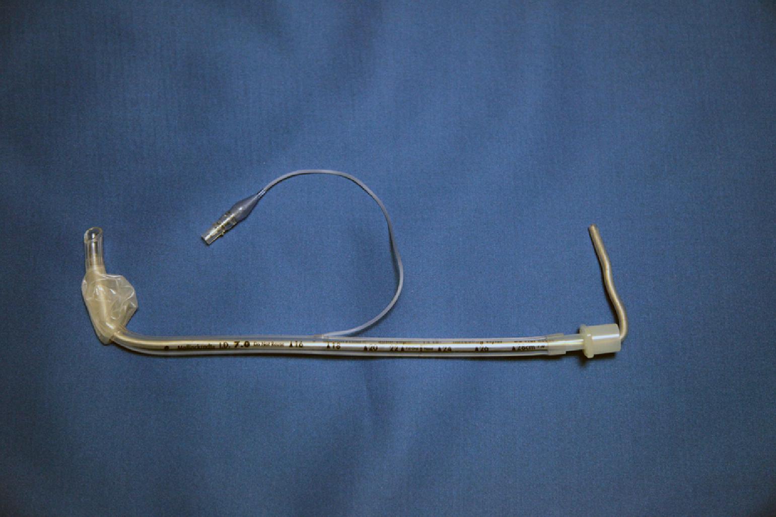 Fig. 22.4, A styletted endotracheal tube (ETT). The stylet remains “straight-to-cuff” at which point the ETT can then be bent to the desired angle like a “hockey stick.”