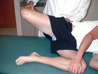 Fig. 90.11, To test for contracture of the iliotibial band, the examiner can use the Ober test, in which the patient is placed in the lateral decubitus position and the knee is flexed to 90 degrees while the hip is abducted to 40 degrees and fully extended, and an attempt is then made to adduct the hip. An inability to adduct past midline signifies tightness within the iliotibial band.