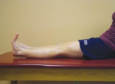 Fig. 108.13, The active heel lift exercise consists of having the patient contract his or her quadriceps muscle group to actively raise the heel off the table, achieving active terminal knee extension.