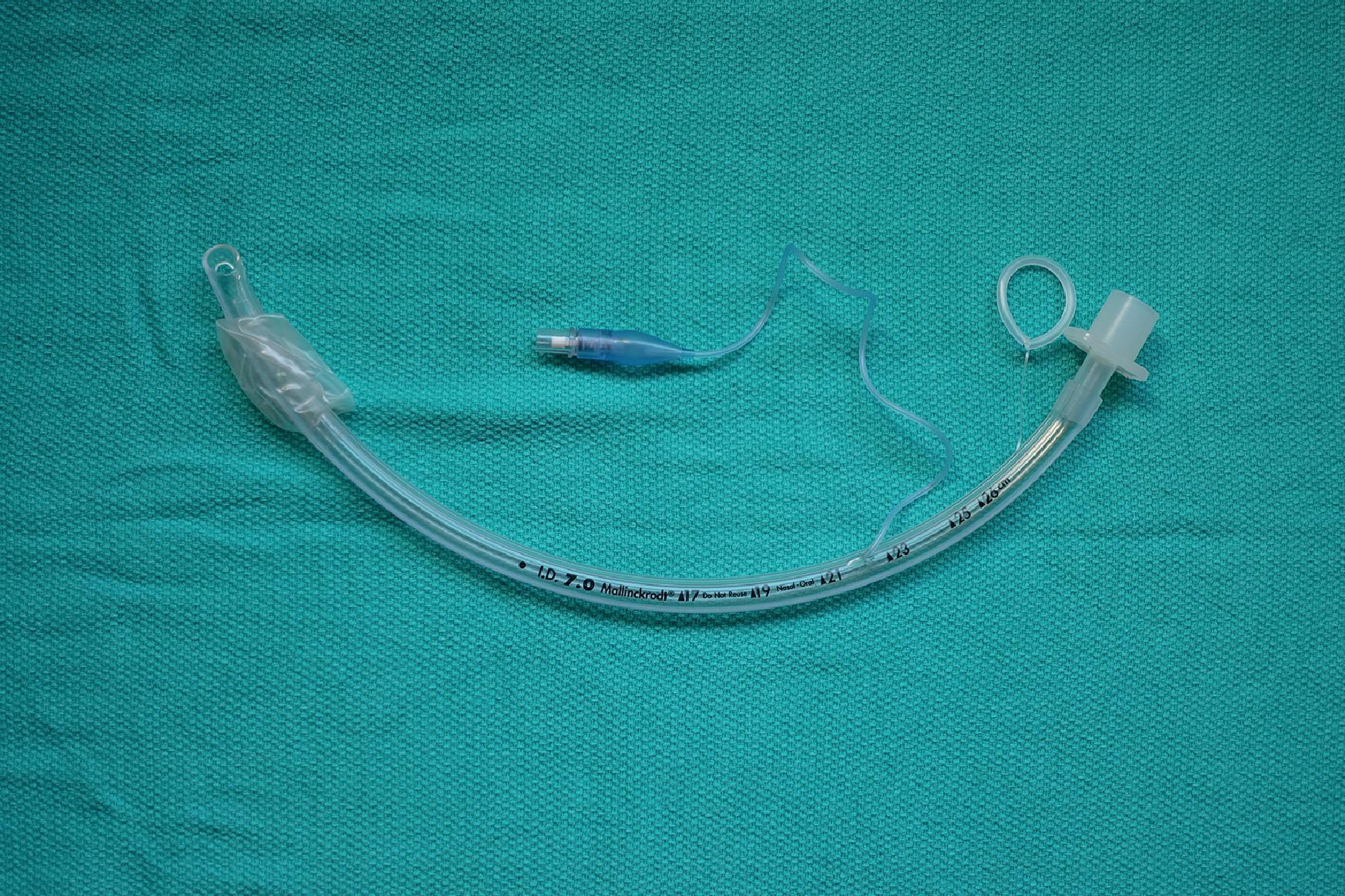 Fig. 21.1, With the stylet in place, the distal half of the ETT is bent to a U shape.