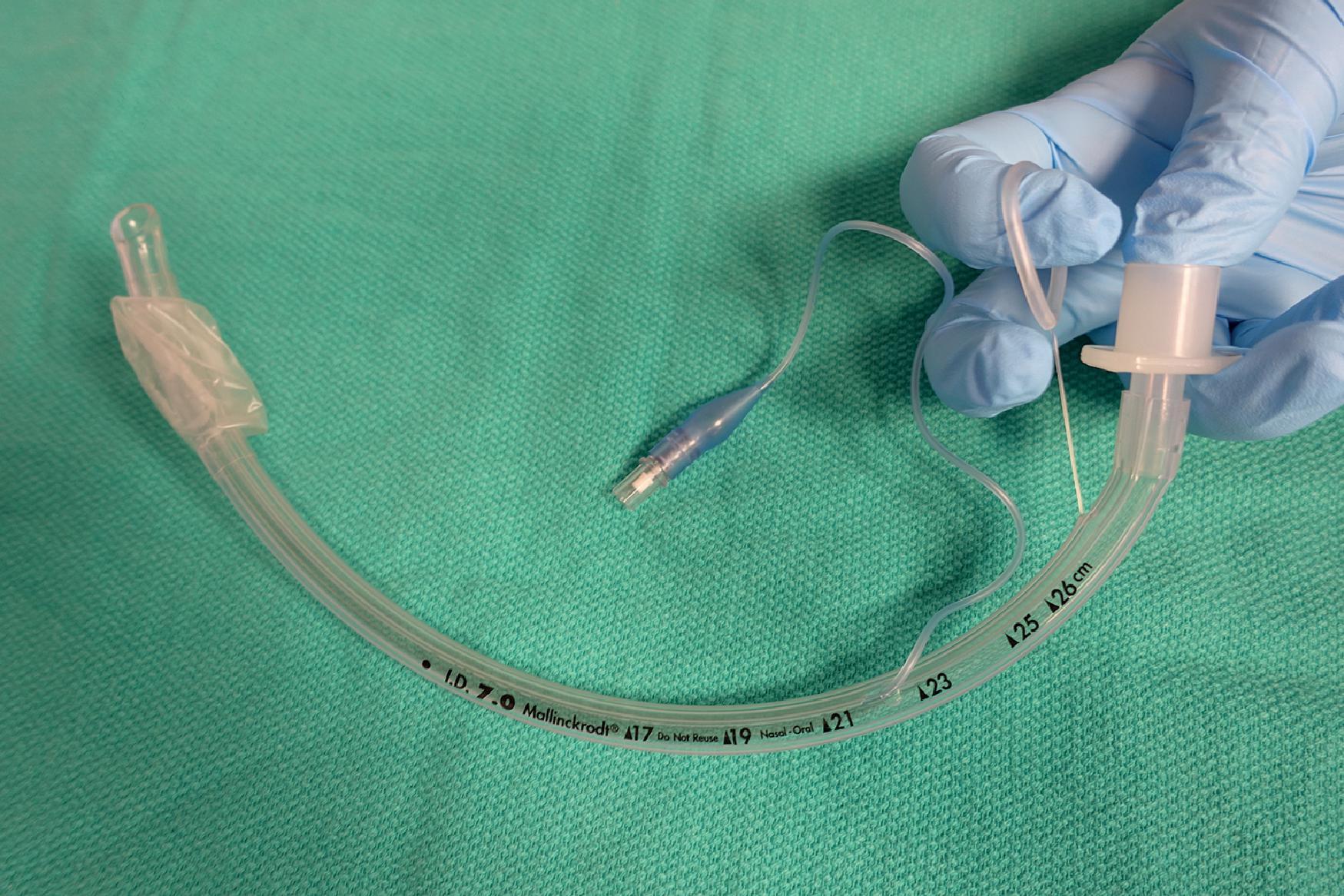 Fig. 21.11, Pulling the ring of the Endotrol Endotracheal Tube exaggerates the natural curvature.