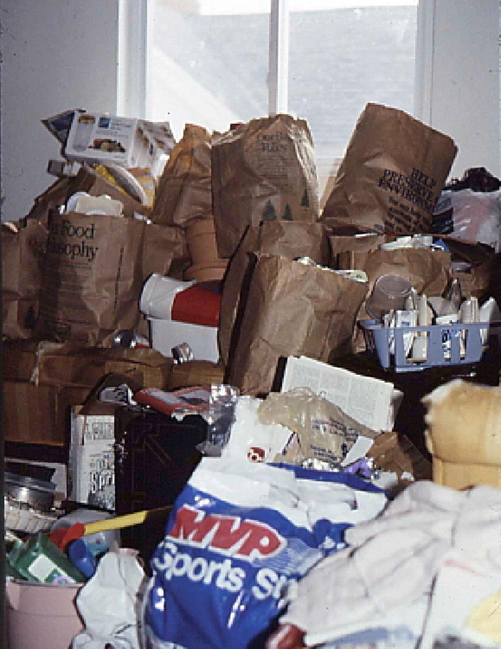 Figure 33-3, Cluttered and overcrowded home of a hoarding disorder patient.