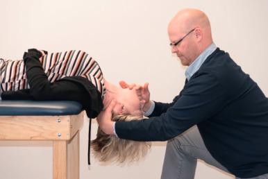 FIG. 110.2, Cervical traction with extension is initially required to allow this patient to return to specific loaded exercises. Again, a thorough mechanical assessment determines the specific direction, pressure, and load of the exercise based on the patient's history and response to movement.