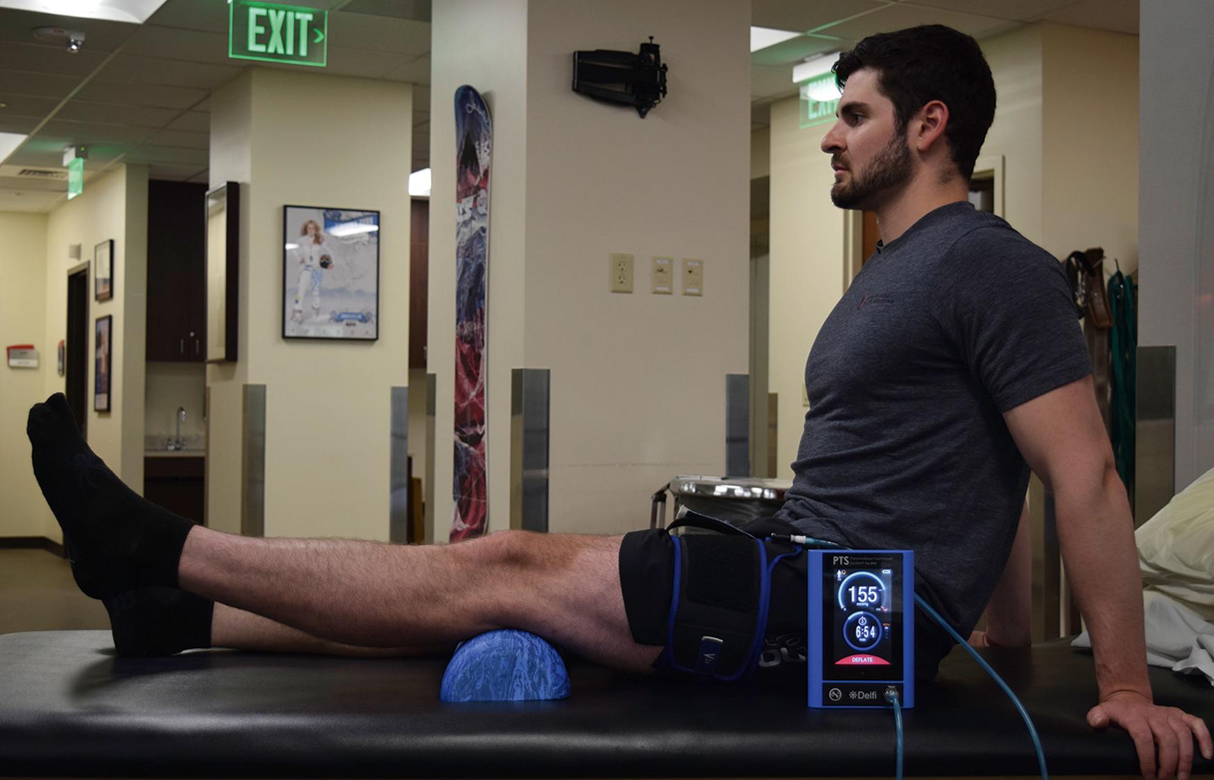 Fig. 41.2, Terminal knee extension using blood flow restriction finish position.