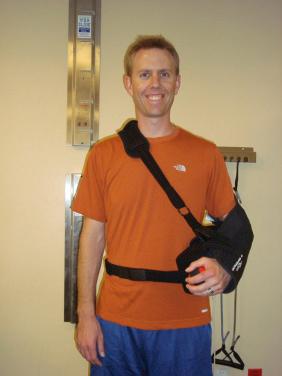 FIG. 31.1, Proper positioning of abduction pillow sling. Arm should rest in approximately 20 degrees of abduction and neutral rotation with elbow in 90 degrees of flexion. Belt attachment is used to prevent accidental abduction of the affected arm.