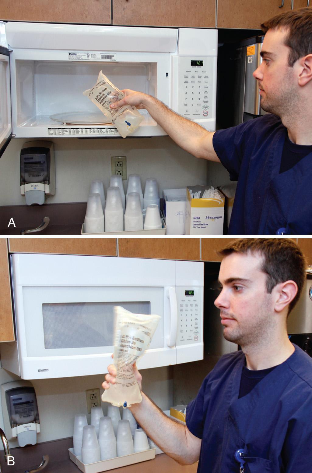 Figure 65.5, A, To rewarm hypothermic patients with intravenous heated saline, a standard 650 W microwave oven, on high for 120 seconds, will raise the temperature of a non–dextrose-containing liter of saline (in a plastic bag) to approximately 100°F. B, Agitate the bag halfway through the warming and again before infusion.
