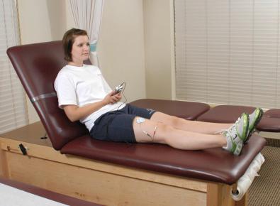 FIG 11-2, Biofeedback therapy is implemented to facilitate an adequate quadriceps muscle contraction early postoperatively.