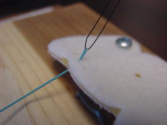 FIGURE 1.26, Nylon suture used to pull the braided suture through the felt model.