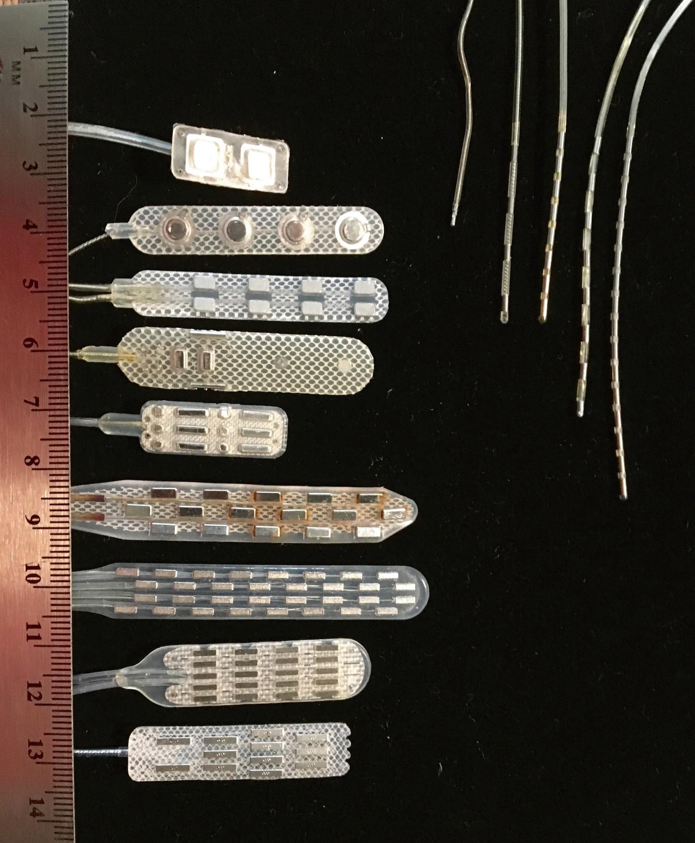 FIGURE 119.8, Spinal cord stimulation electrodes are arrays with multiple contacts (up to 32). Some require a limited laminectomy, and others may be inserted percutaneously through a modified Tuohy needle.