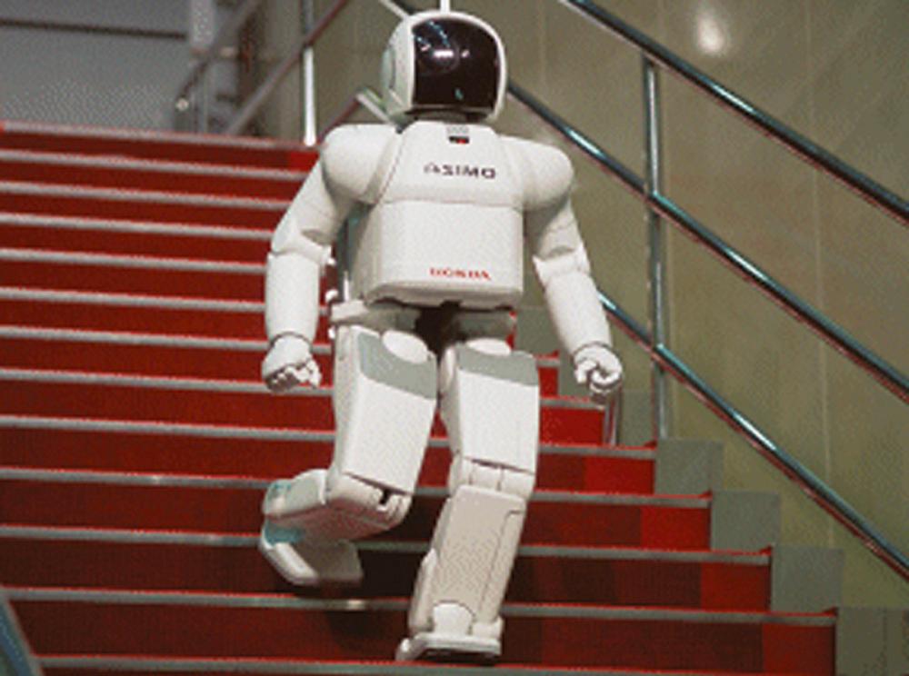 Fig. 124.1, The ASIMO from Honda is a humanoid robot that is capable not only of walking but of negotiating stairs.