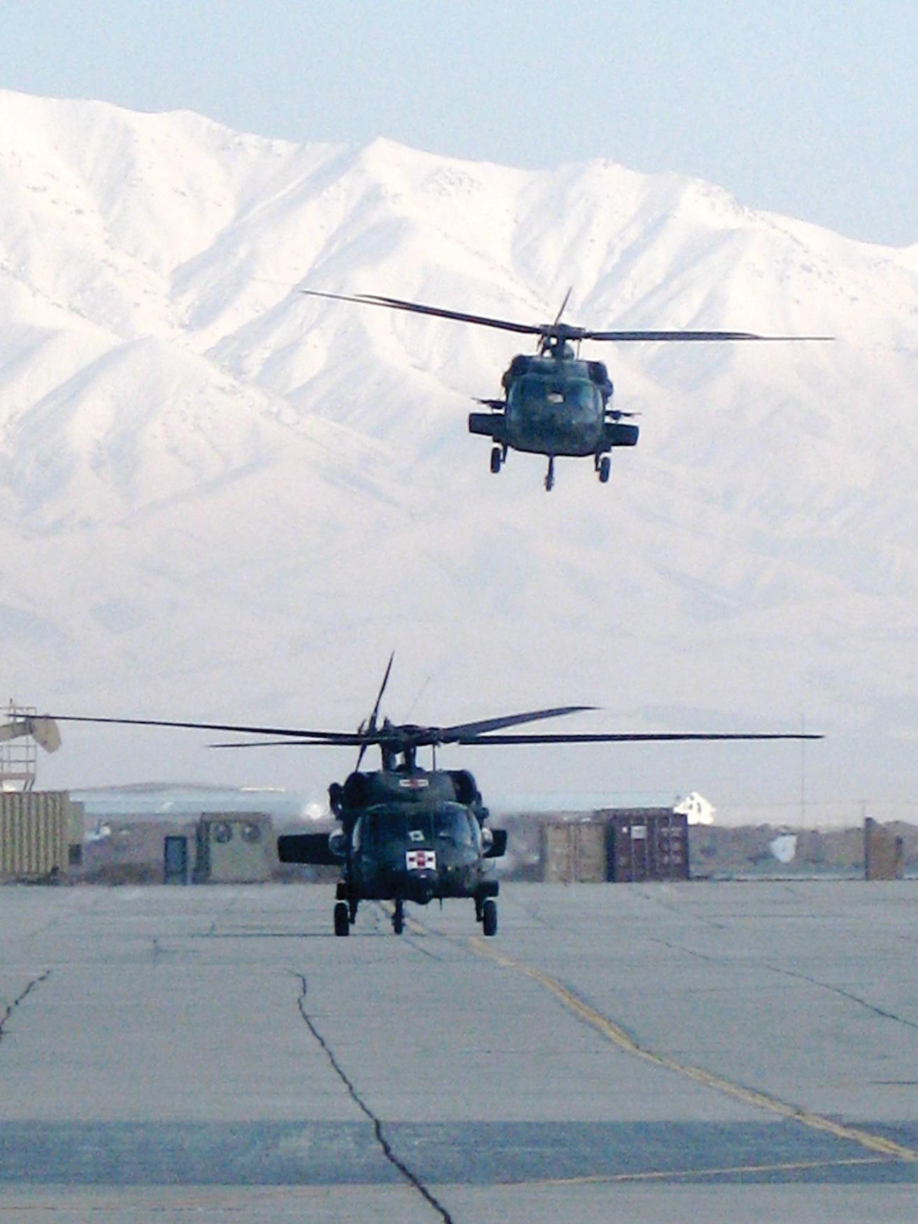 FIGURE 7, U.S. Army Medical Evacuation (MEDEVAC) helicopters depart from Bagram Airfield on mission to retrieve patients from point of injury circa 2009. En route care will be provided by flight medics.