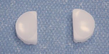 FIGURE 33A.3, Polyethylene tibial skids for the tibial component of the articulating joint prosthesis.