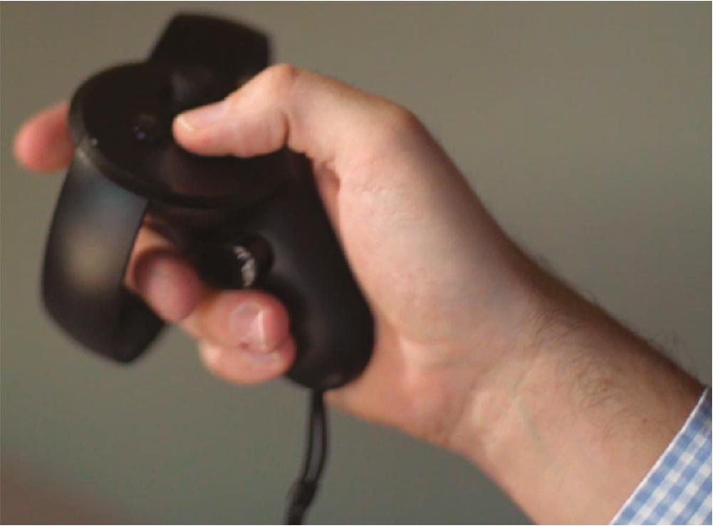 Fig. 24.3, Handsets are used to control the virtual reality environment. Relatively few buttons help to keep the control simple and intuitive, but are supplemented by internal gyroscopes, magnetometers, and accelerometers for motion tracking.