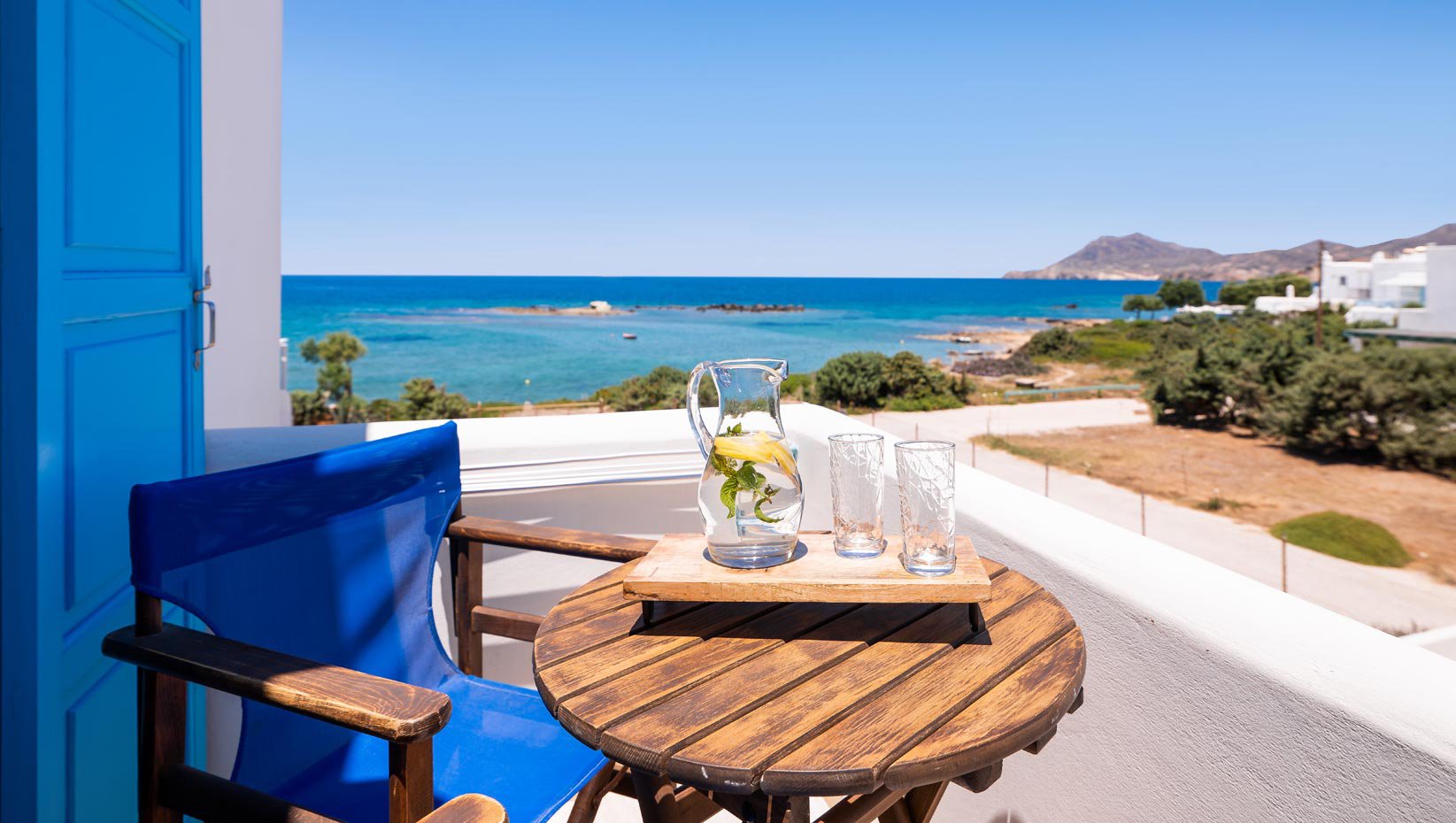 Domus Litus Superior Studio balcony with sea view and little table with lemonade on it.