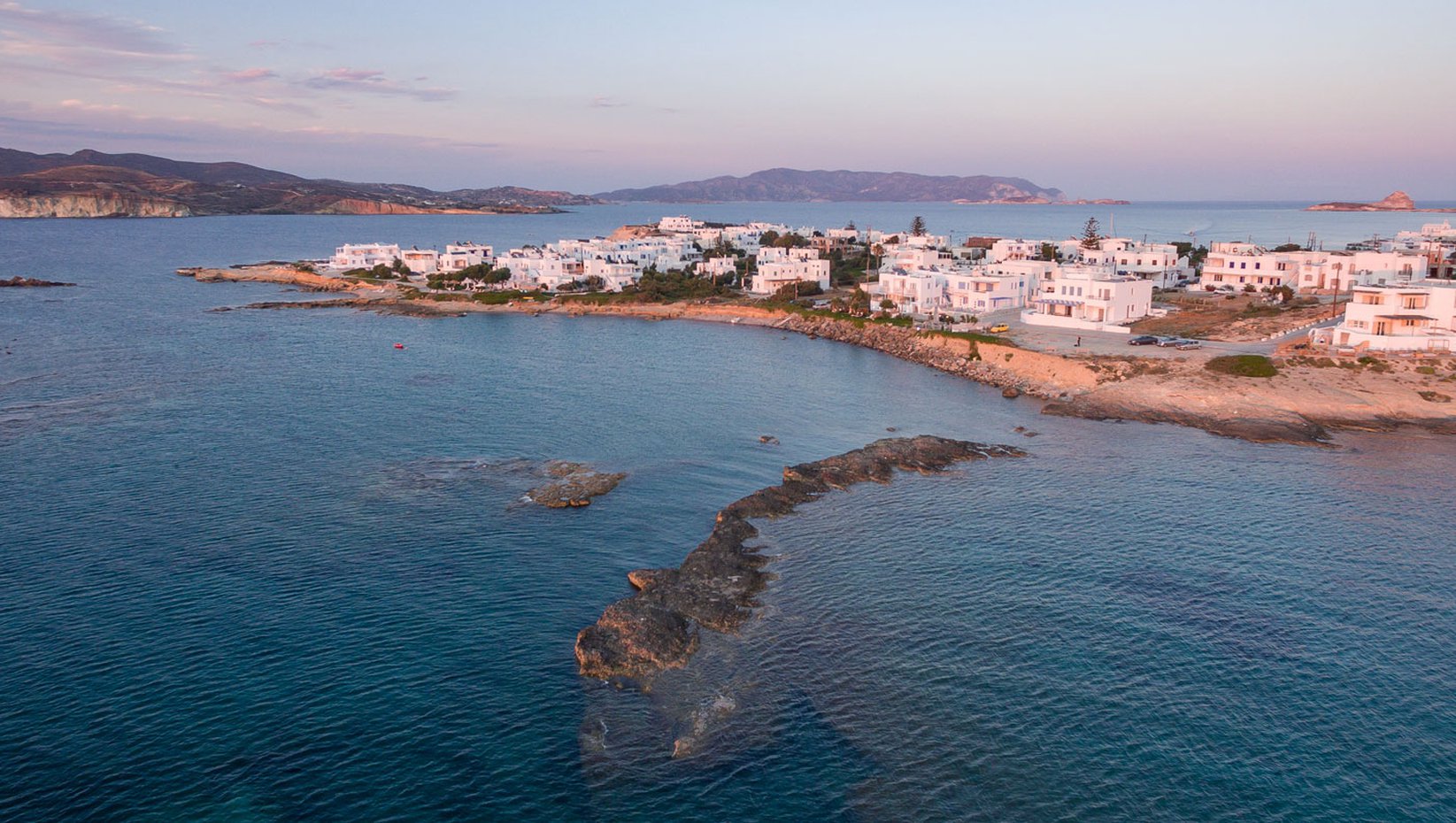 Pollonia vilage in Milos island in the afternoon, drone view.