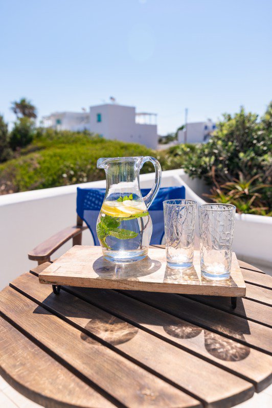 Domus Litus Superior Studio balcony with sea view and little table with lemonade on it.