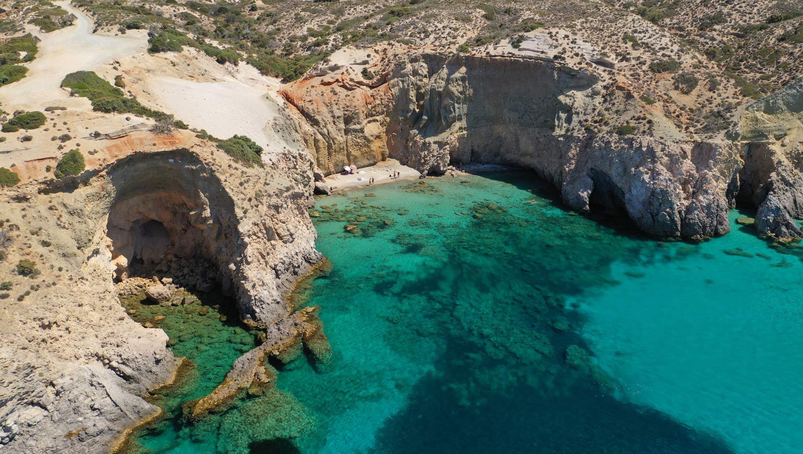 Beach in Milos island. White rocks and crystal blue water.
