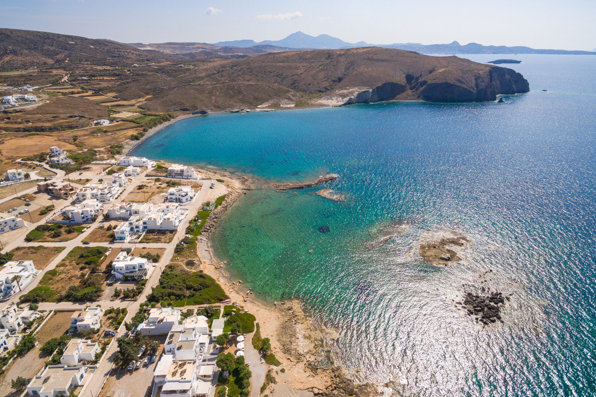 Milos island drone view. Traditional white Cycladic houses. and sea view.