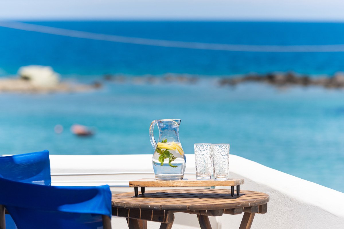 Domus Litus Superior Studio balcony with sea view and little table with lemonade on it.