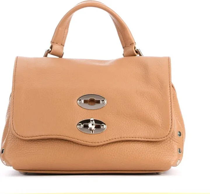 Zanellato Postina Daily Baby bag in cappuccino grained leather. Silver metal side details and studs. Removable and adjustable shoulder strapSwivel closureLinedWater-repellentEach Zanellato product is a unique and original artifact: for this very reason some details