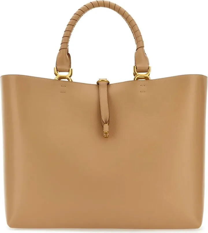 Shopping bag realized in sightly pebble calf leather characterized by embossed logo at the front.