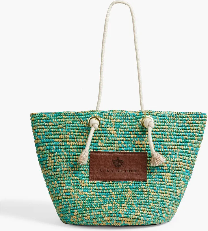 Leather-trimmed tasseled raffia tote