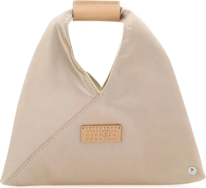Handbag realized in satin characterized by contrasting stitching at the back enriched by logoed leather label at the front.
