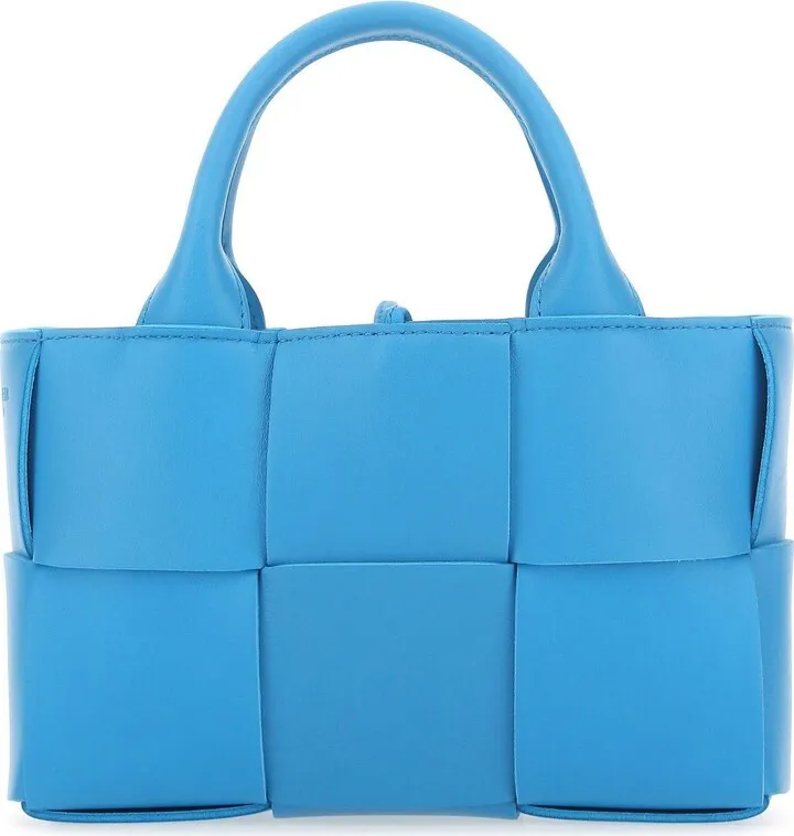 Crossbody bag realized in lamb leather characterized by iconic Intrecciato motif on the entire surface.