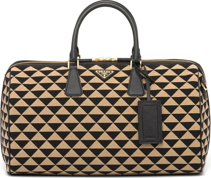 Symbole embroidered fabric travel bag