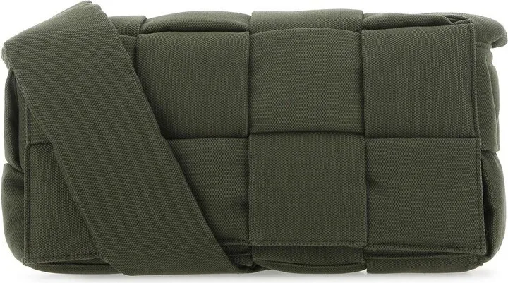 Crossbody bag realized in fabric characterized by iconic Intrecciato motif on the entire surface.
