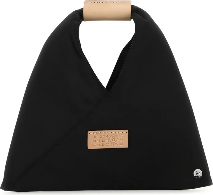 Handbag realized in satin characterized by contrasting stitching at the back enriched by contrasting logoed leather label at the front.