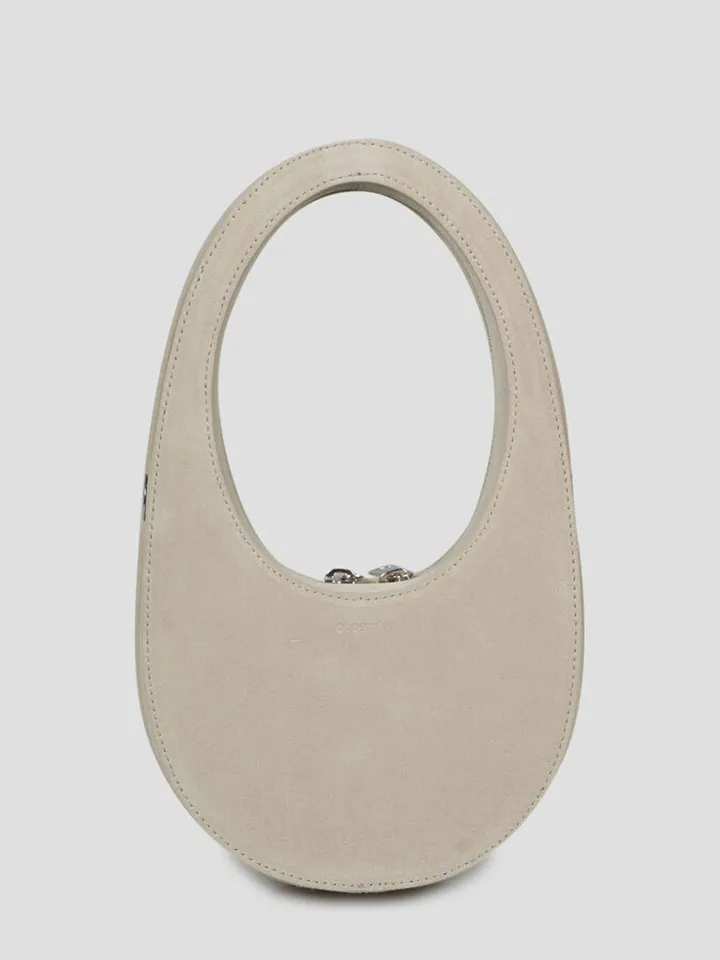 Coperni leather crossbody oval-shaped bag.