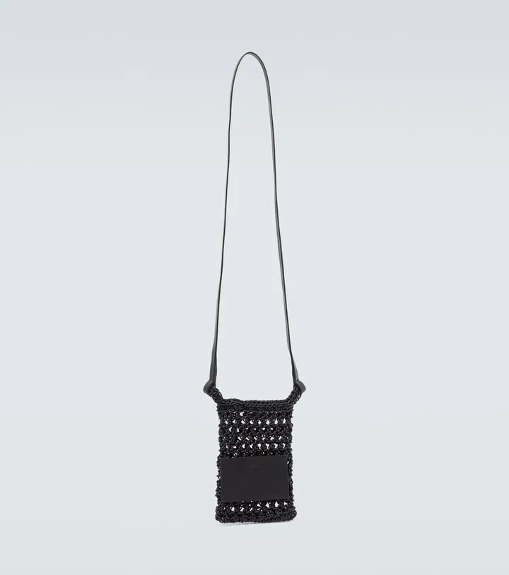 Leather-trimmed crochet crossbody bag