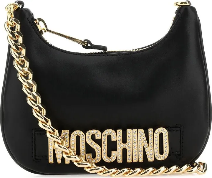 Handbag realized in slightly pebble leather enriched by metal lettering logo at the front.