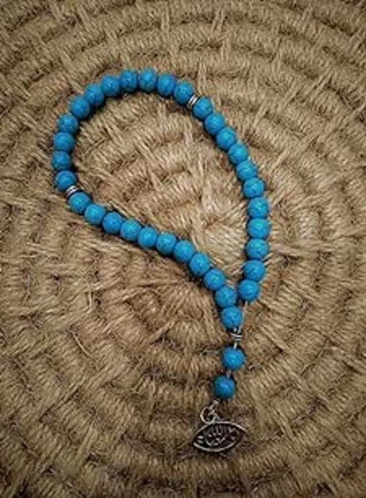 Stone rosary 33 pieces turquoise with a silver religious pendant