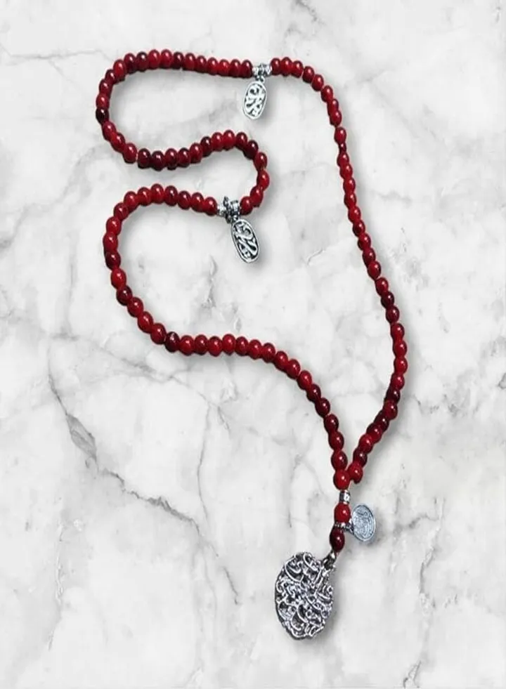 Red rosary with 99 beads made of gemstones with pendants