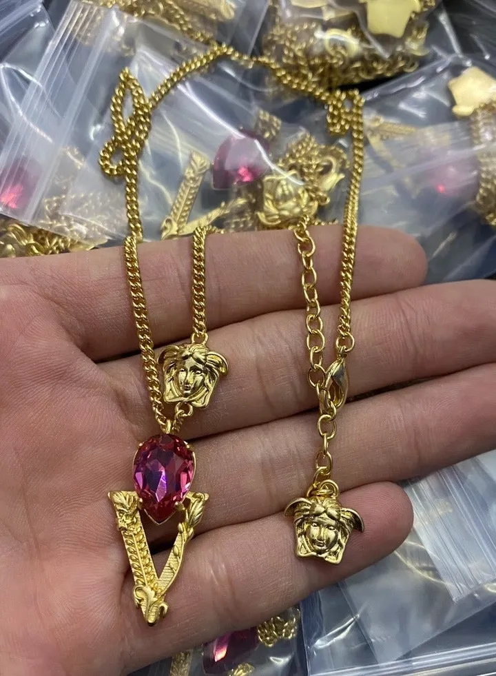 Versace Women's Classic MEDUSA Ruby V-shaped Pendant with Gold Necklace
