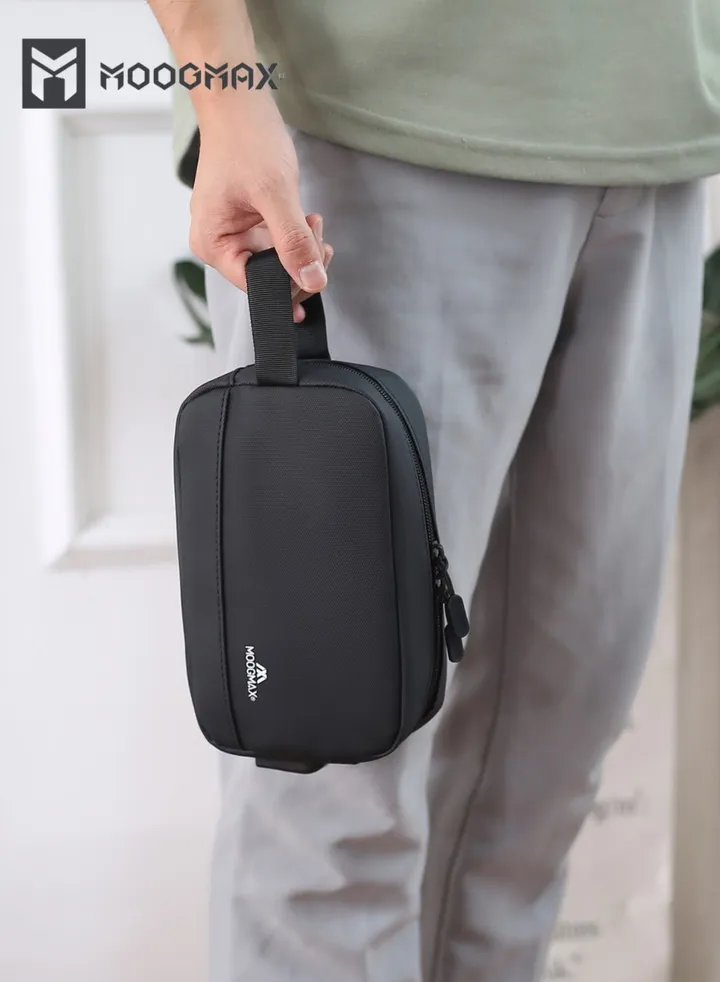 Waterproof handbag with a USB port and ample space for storage and a handle for carrying - made of waterproof fabric, suitable for carrying a mobile phone, cards, cosmetics, and personal items. Black
